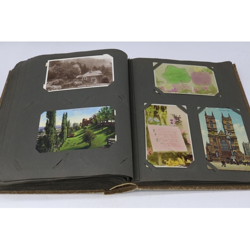 138 - A 1914 postcard album containing approx. 300 vintage postcards