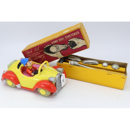 91 - A Noddy car and new old stock shoe stretcher.