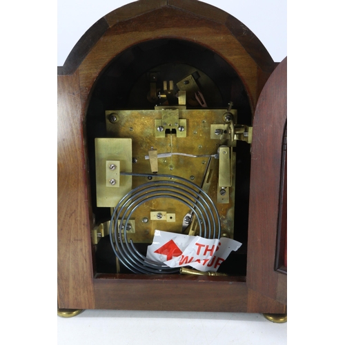 35 - An Edwardian bracket clock with striking movement, having silvered dial and 1/4 column mouldings to ... 