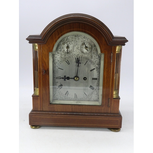 35 - An Edwardian bracket clock with striking movement, having silvered dial and 1/4 column mouldings to ... 
