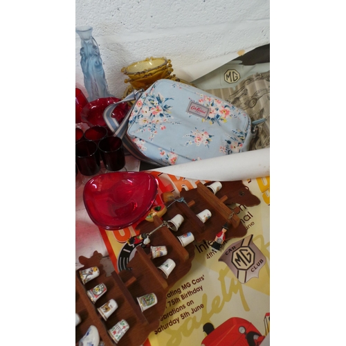 569 - Two carton of mixed house-clearance items including; thimbles, red / cranberry glass, MG posters etc... 