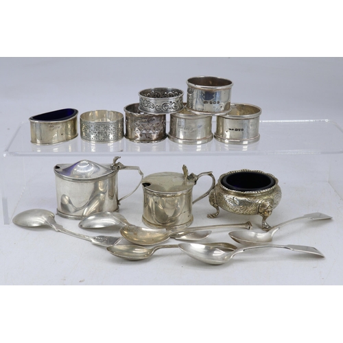 21 - 6 assorted silver hallmarked napkin rings, silver mustard pot with blue liner, another silver simila... 