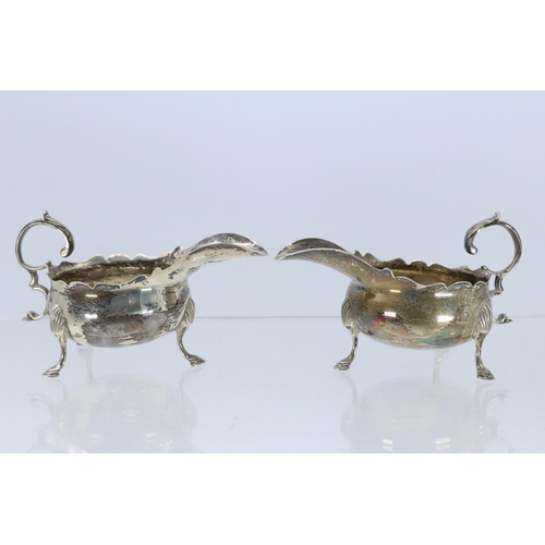 28 - A matching pair of silver hallmarked cream jugs (approx. weight 130g)