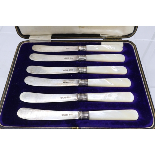 34 - A cased set of six silver bladed fruit knives with mother of pearl handles