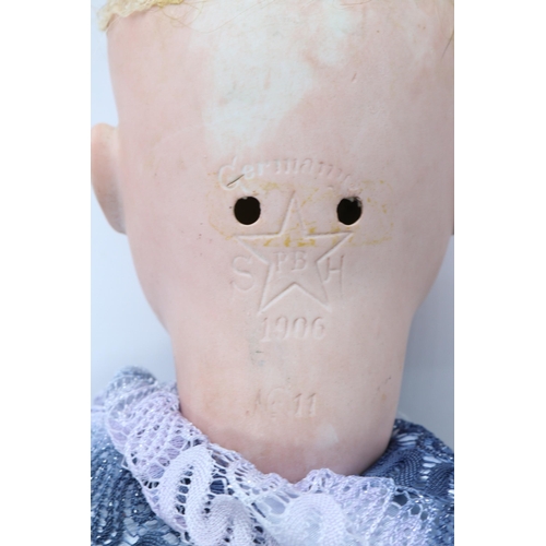 87 - Early 20th century bisque headed doll stamped SH with PB inside a five pointed star. Schoenau & Hoff... 