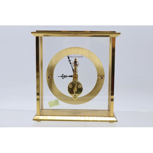 147 - Jaeger Le-Coultre gilt metal mantle clock with front and back clear glass panels.