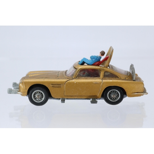 149 - A Corgi James Bond Aston Martin DB5 with two passenger figures and a driver