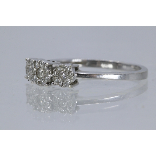 219 - A 9ct white gold three stone diamond ring (approx 1.9g)