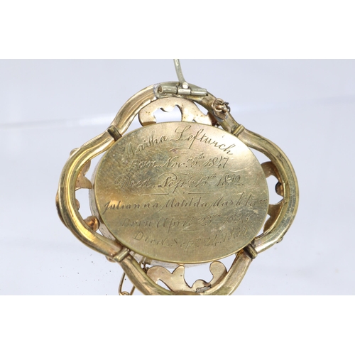 263 - Unmarked gold? mourning locket with domed glass either side together with two similar