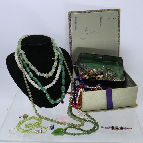 268 - A small box of assorted costume jewellery including necklaces (necklace stand is not included)