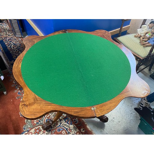 284 - Antique fold over walnut card table.