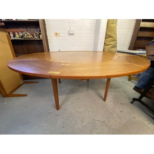 510 - A danish made Dyrlund extending dining table together with 2 carver chairs and four dining chairs (c... 