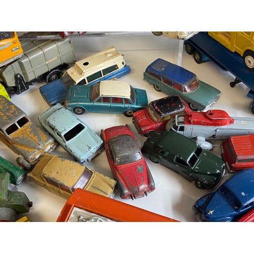 569 - A large quantity of mainly dinky toys playworn vehicles coaches, cars etc