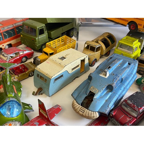 569 - A large quantity of mainly dinky toys playworn vehicles coaches, cars etc