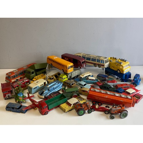 569 - A large quantity of mainly dinky toys playworn vehicles coaches, cars etc