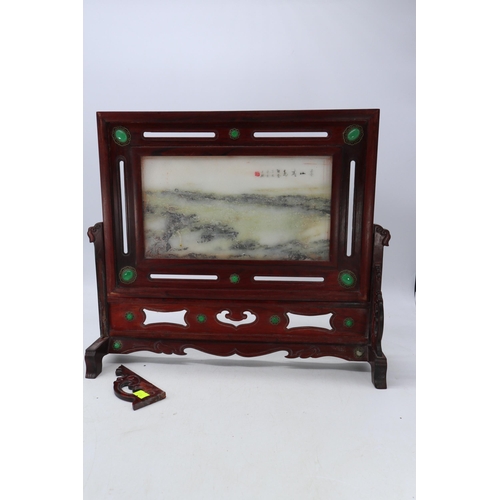 626 - Oriental hardwood stand with cloisonné panel and set with jade?