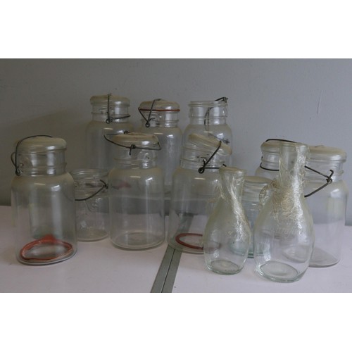 655 - Selection of vintage bottles, plated cups, quantity of Atlas Kilner style jars and covers and other ... 