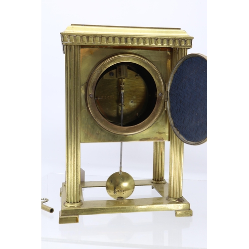 323 - Brass cased mantle clock, with pendulum and key, missing porcelain panels