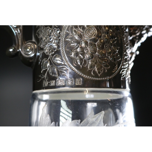 77 - Silver mounted cut glass claret jug, marked to base Katie Richardson, Atlantis, approx. 28cm high