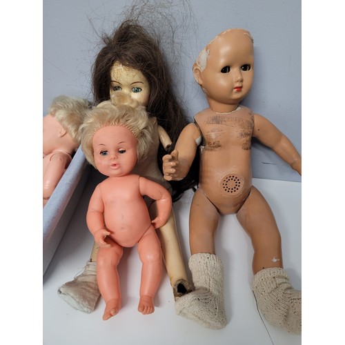 558 - Box of assorted dolls and doll parts