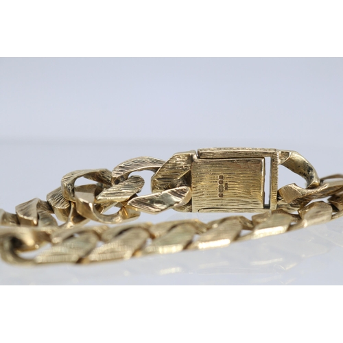 35 - 375 9ct gold bracelet with spare link, approx. weight 39.4g