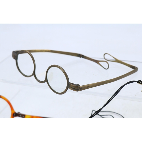 159 - Early antique reading glasses, together with two monocles , and a pair of gauze eye covers/protector... 