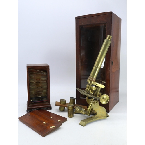 240 - Antique solid brass microscope, in glass fronted mahogany case, comes with spare eye pieces. Also a ... 