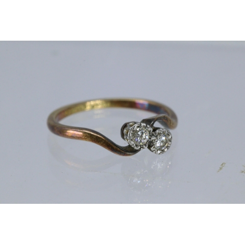 54 - An 18ct gold crossover diamond ring (approx. size M/N)