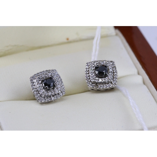 56 - A pair of diamond and sapphire earrings