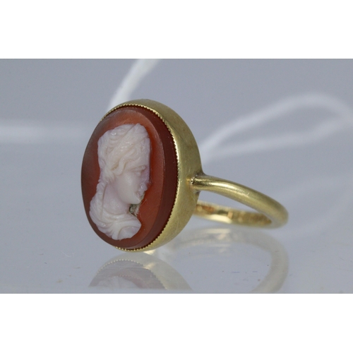 64 - 18ct gold ring with inset cameo