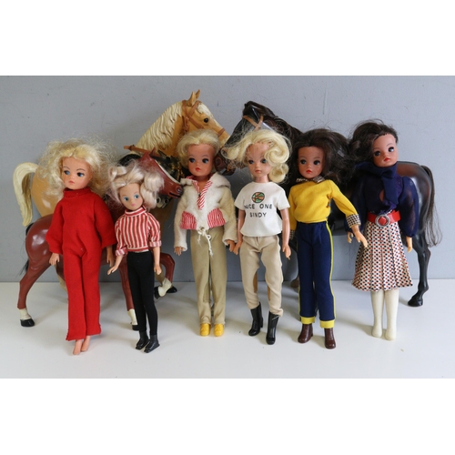 275 - Selection of vintage Sindy dolls with box of loose accessories and horses