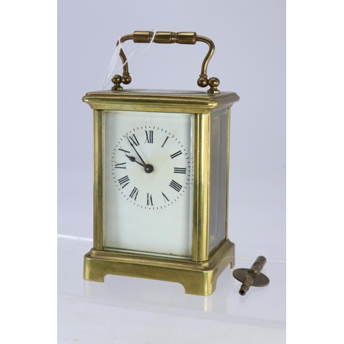 278 - A brass cased carriage clock with key