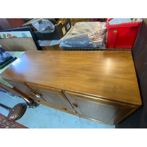 330 - An Ercol Windsor 1960's sideboard (with blue label) on tapered legs, fitted two cupboards over singl... 