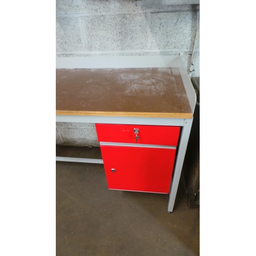 16 - A good quality workbench fitted with vice and locking drawer and cupboard. It measures approx' 149W ... 