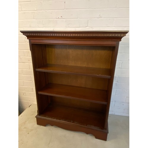 54 - A Waterfall bookcase together with a reproduction mahogany finish bookcase.