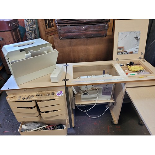 56 - Bernina 1230 sewing machine and cover inside a custom sewing cabinet with contents trade/spares/repa... 