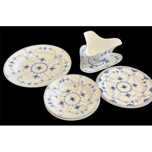 118 - A large collection of Copenhagen blue fluted ceramic in various styles including lace-edged pattern.... 