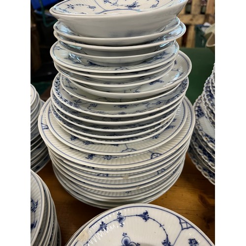 118 - A large collection of Copenhagen blue fluted ceramic in various styles including lace-edged pattern.... 