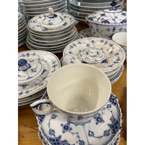 118 - A large collection of Copenhagen blue fluted ceramic in various styles including lace-edged pattern.... 