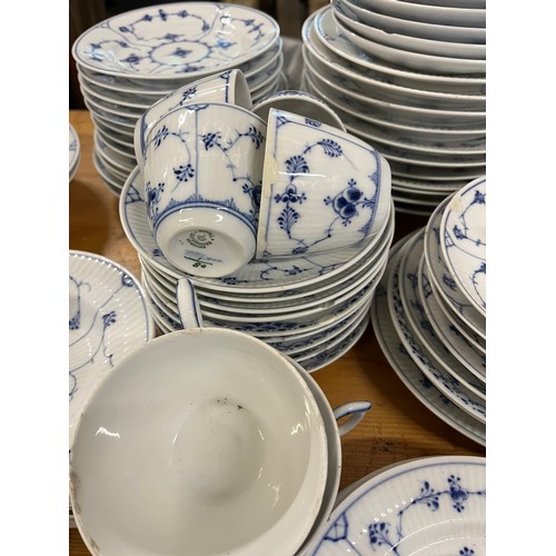 118 - A large collection of Copenhagen blue fluted ceramic in various styles including lace-edged pattern.... 