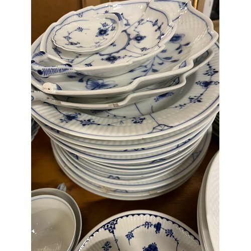 118 - A large collection of Copenhagen blue fluted ceramic in various styles including lace-edged pattern.... 