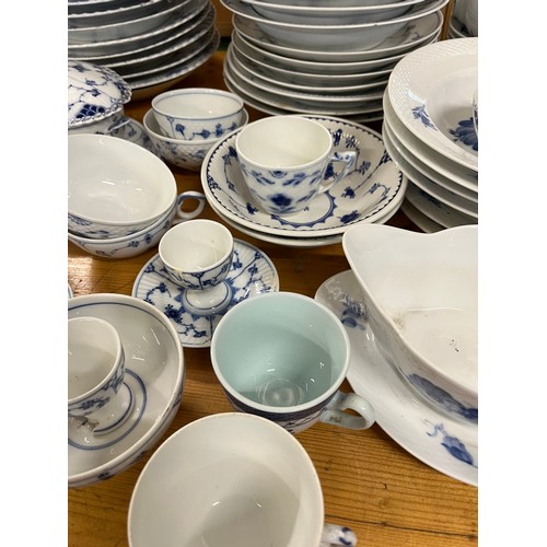 118 - A large collection of Copenhagen blue fluted ceramic in various styles including lace-edged pattern.... 