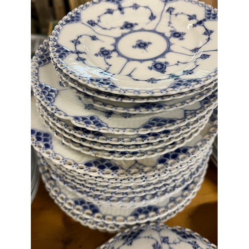 118 - A large collection of Copenhagen blue fluted ceramic in various styles including lace-edged pattern.... 