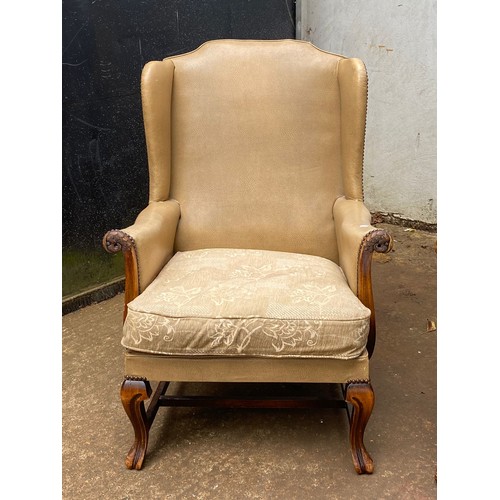 145 - Pair of rexine covered wingback armchairs