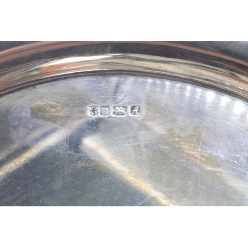 22 - A hallmarked silver tray with decorative edge (approx. 800g)