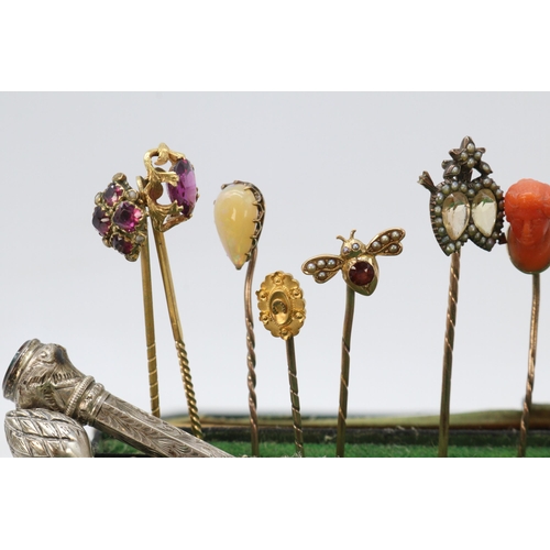 102 - A good selection of antique and later stick pins gold, some unmarked and silver some decorated with ... 