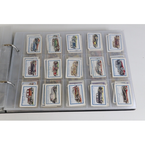 222 - A binder containing plastic sleeves filled with over 500 different loose trade cards issued by D C T... 