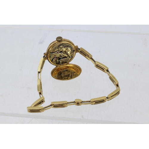 242 - An 18ct gold watch and strap (total weight approx. 27.8g) face finished with enamel, slight damage n... 