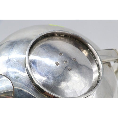 4 - A William IV Silver teapot of flatten spherical form, with reeded Horizontal band decoration, domed ... 