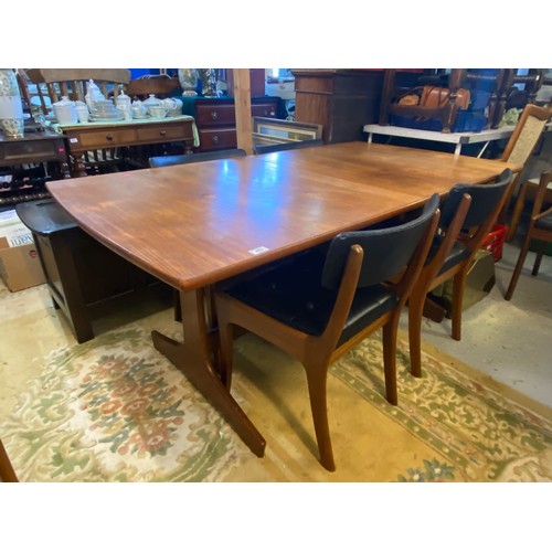 403 - Teak Danish dining table and six chairs including carvers, (the filling on the chairs does not confo... 